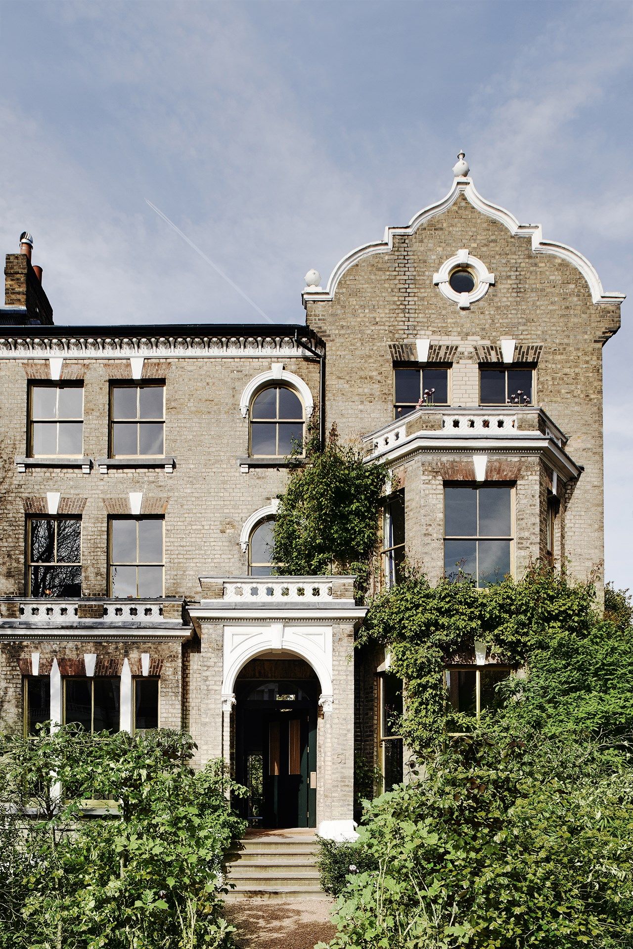 Image may contain Home Decor Building City Urban Town High Rise Window Apartment Building and Housing