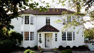 Image may contain Cottage House Building Housing Door Plant Grass and Roof