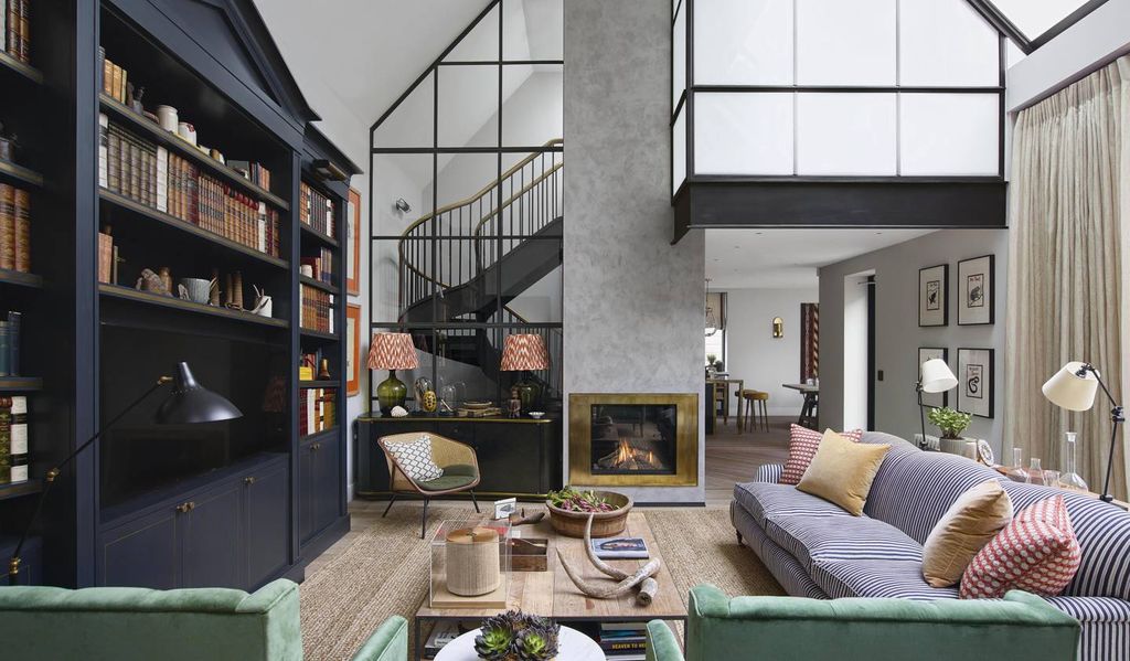 Image may contain Living Room Room Indoors Furniture Interior Design Couch Shelf Table Cushion and Housing