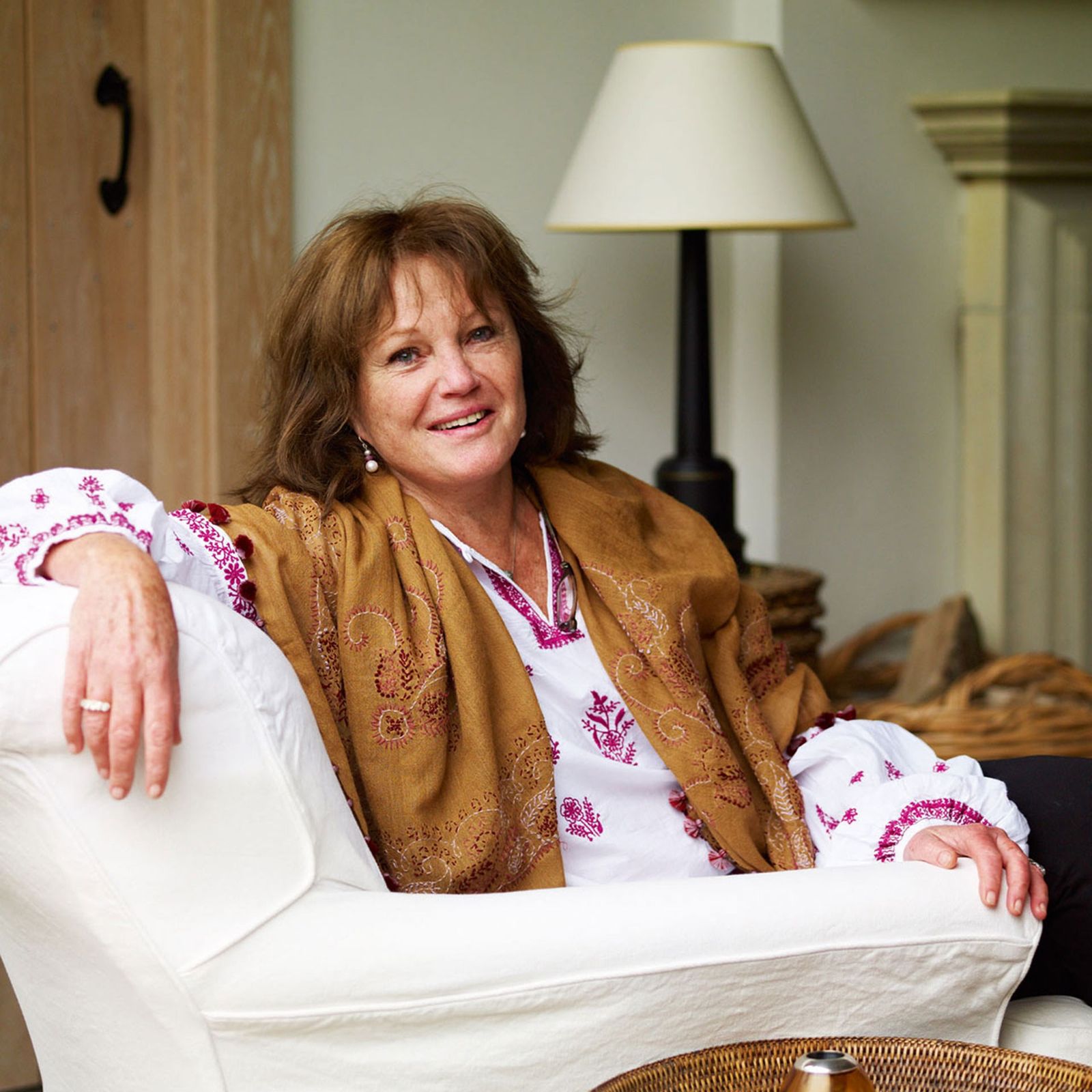 Image may contain Furniture Couch Lamp Human Person and Table Lamp