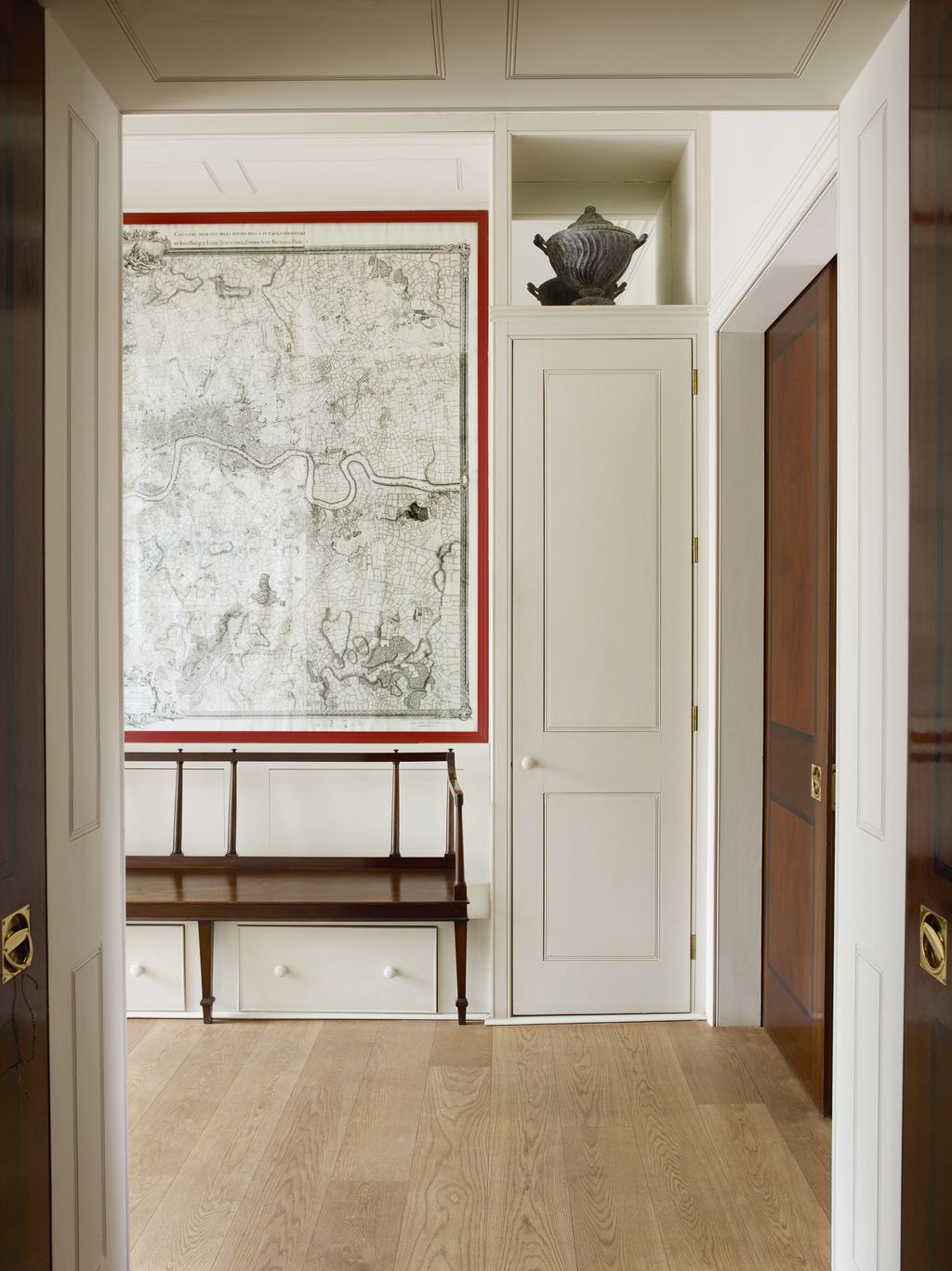 Another urn stands in the second hall part of the Soanean enfilade which is a feature of the ground floor.