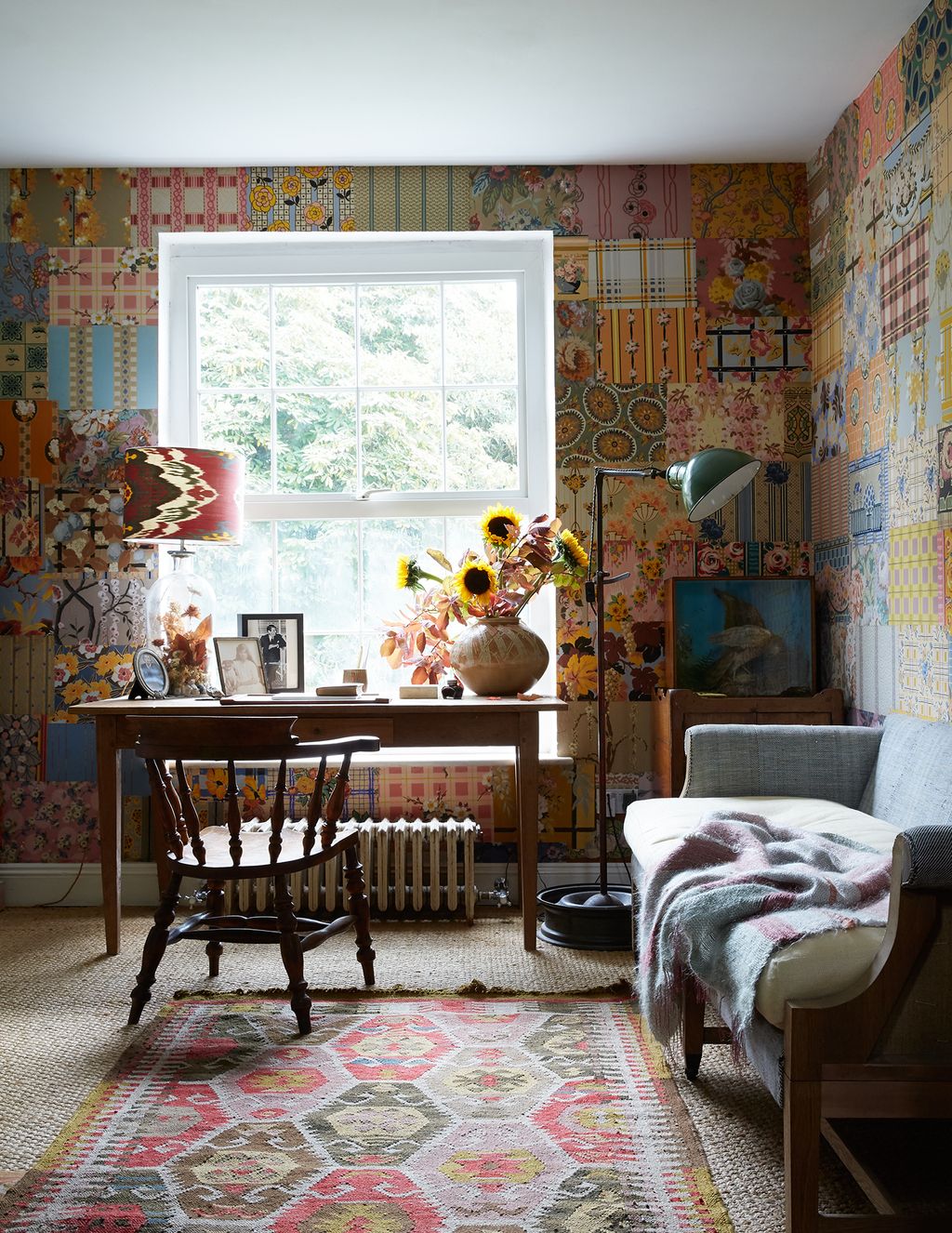 Image may contain Living Room Indoors Room Furniture Rug Interior Design and Table