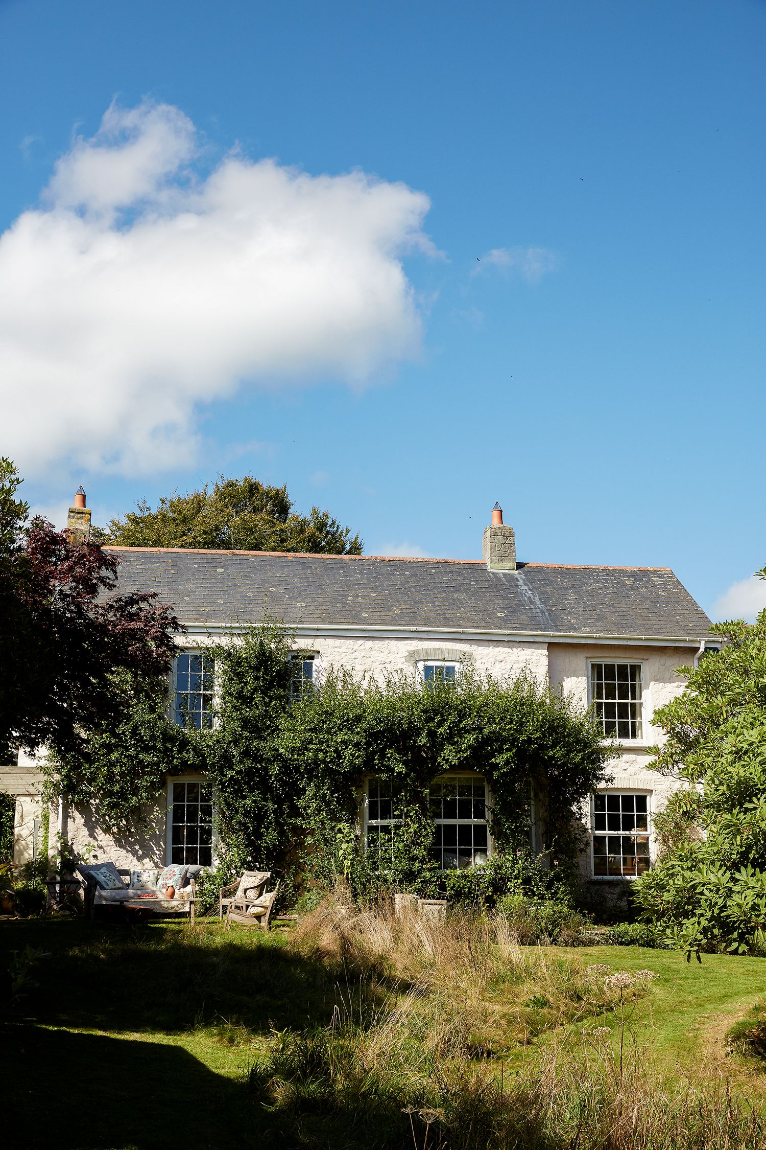 Image may contain Cottage Housing House Building Outdoors Nature Plant Grass Tree Shelter Countryside and Rural