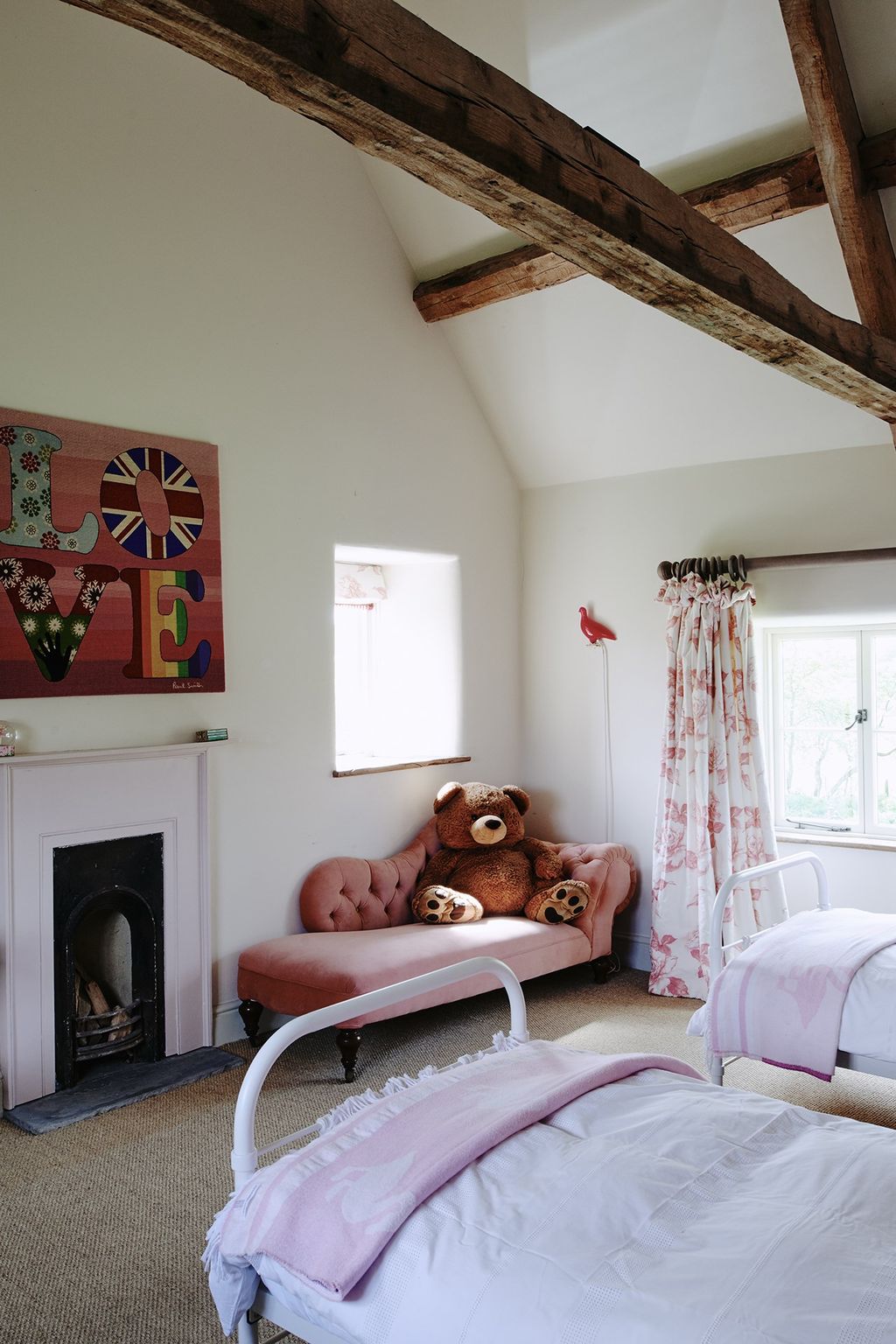 Image may contain Indoors Interior Design Room Bedroom Living Room Furniture Fireplace Hearth and Shelf