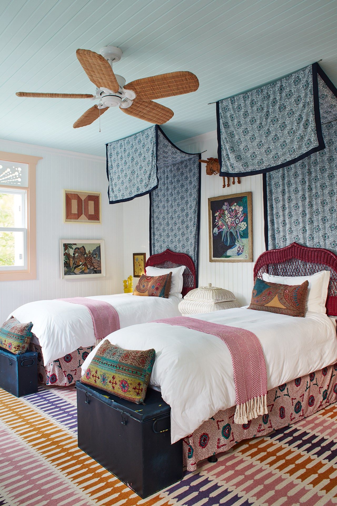 Image may contain Indoors Room Bedroom Dorm Room Ceiling Fan Appliance Rug Furniture and Bed