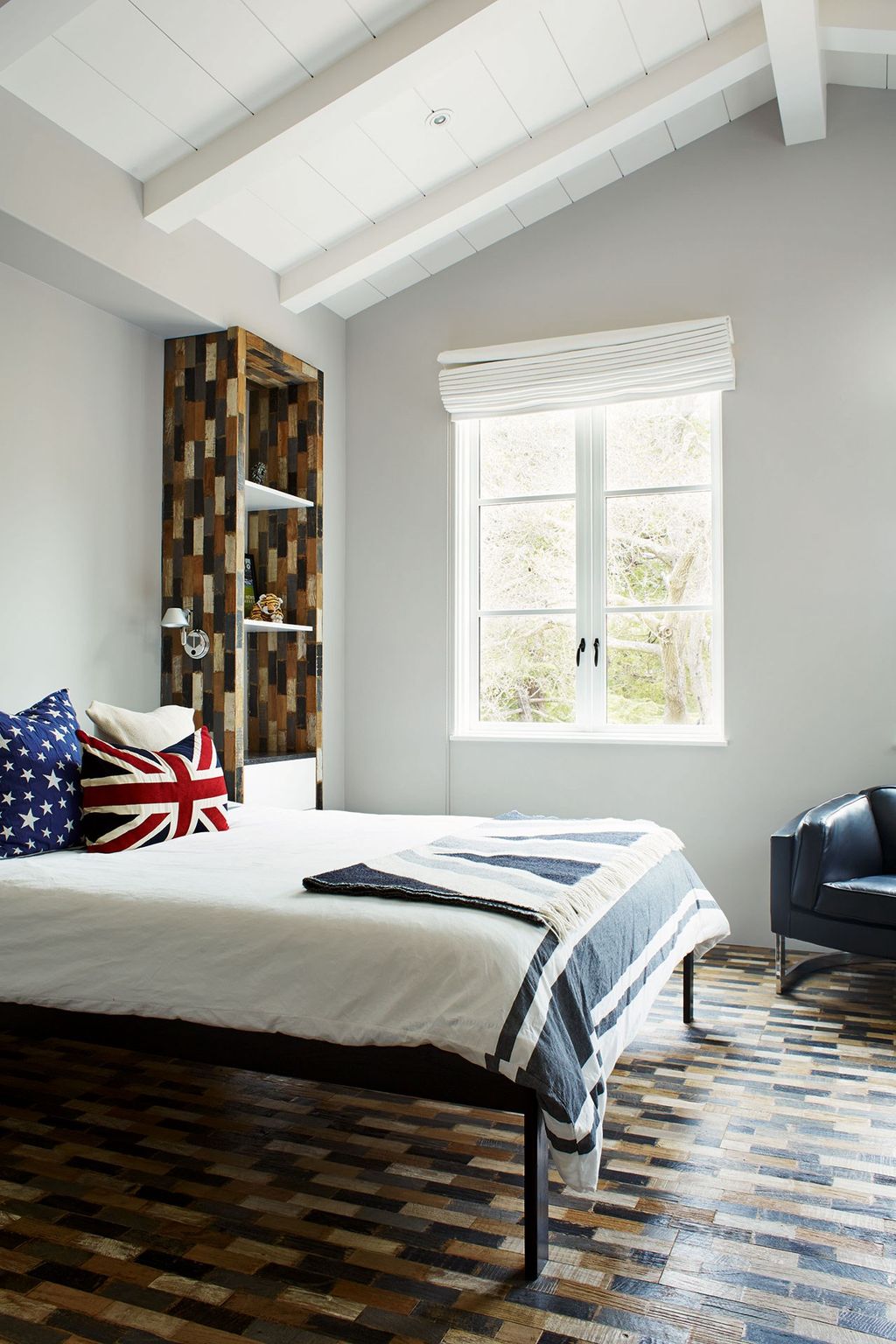 In a son's bedroom the floor has become a design feature. Blocks of wood were stained in a variety of colours before...
