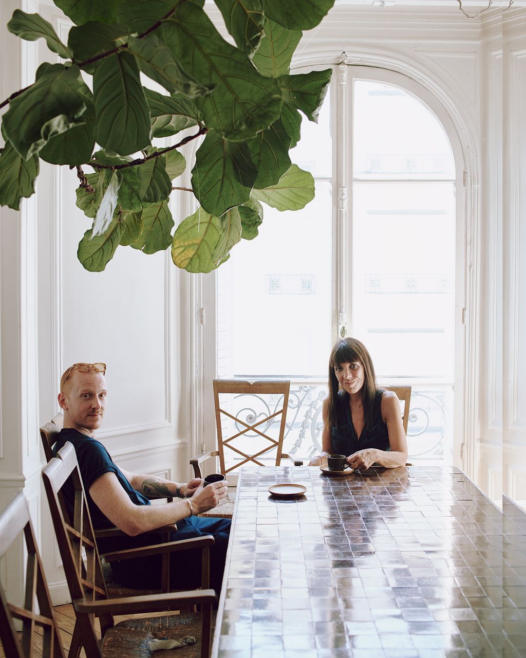 John with fellow designer Valrie Vais in her flat near the Gare du Nord where he stays when he is working in Paris.
