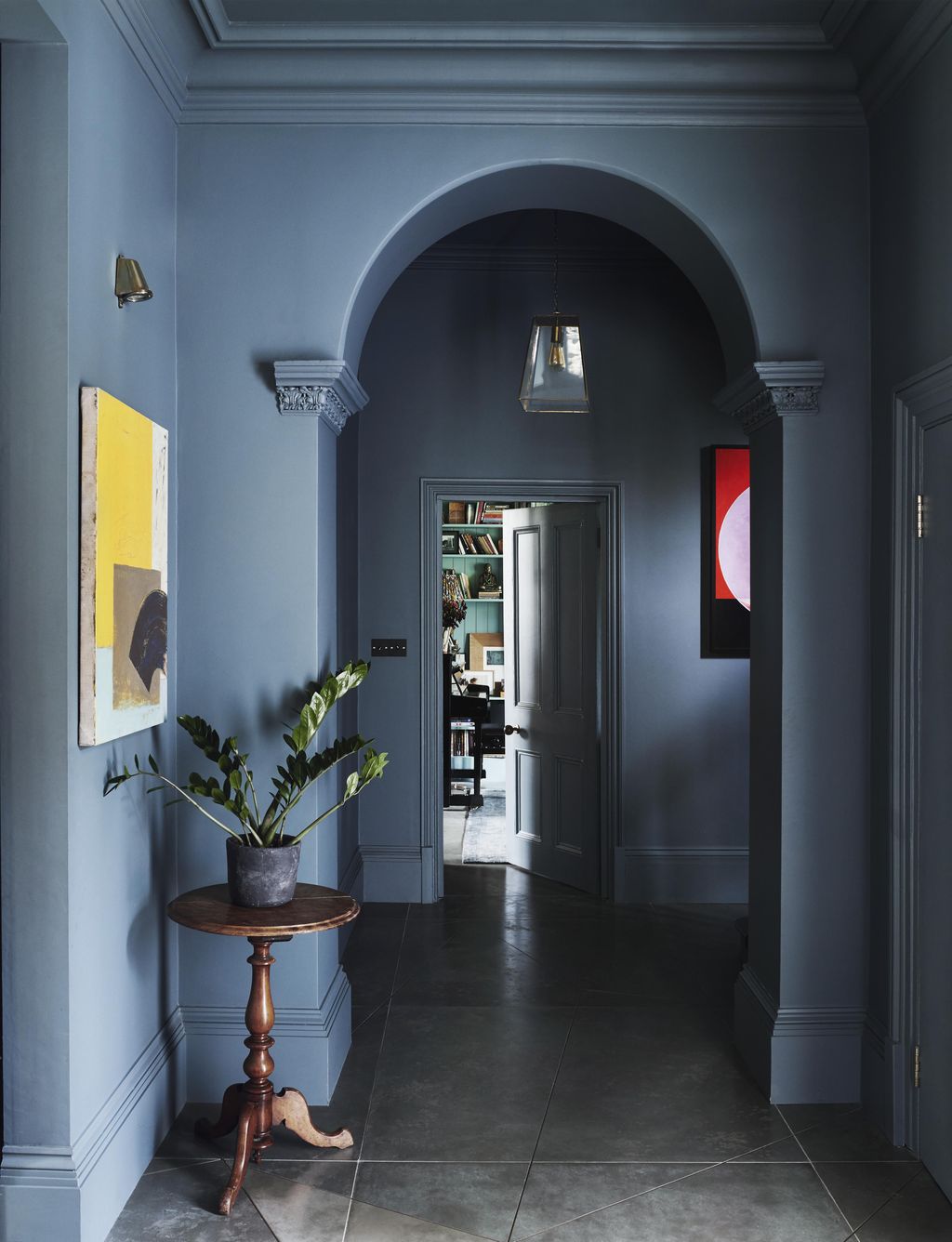 In this house designed by Rachel Chudley walls and woodwork in a stormy grey created by paint specialist Donald Kaufman...