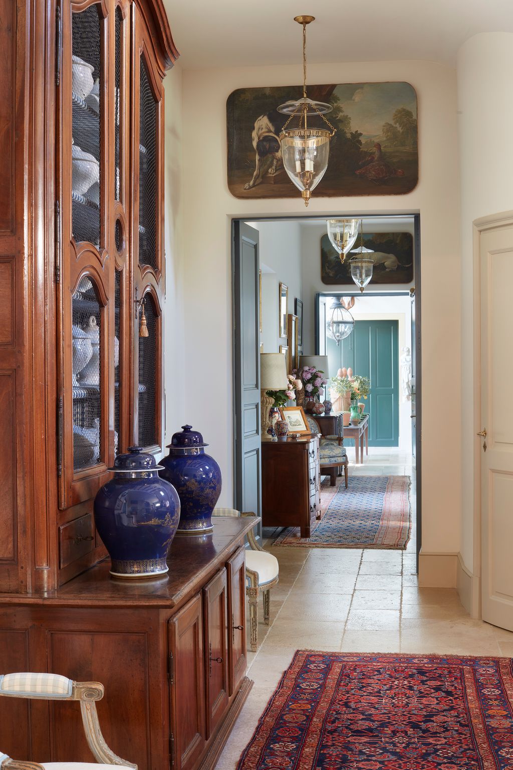 Image may contain Furniture Interior Design Indoors Flooring Shelf Floor Living Room Room Cabinet and China Cabinet