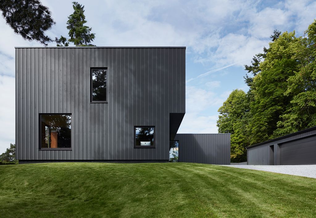 Image may contain Plant Grass Lawn Building Tree and Housing