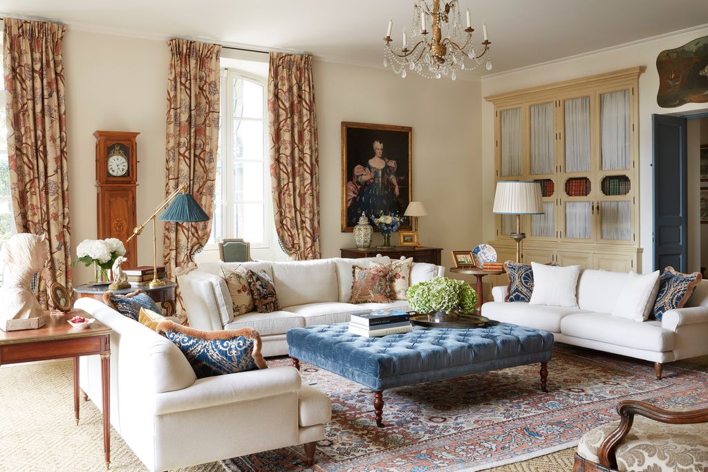 Image may contain Furniture Living Room Indoors Room Rug Couch and Table