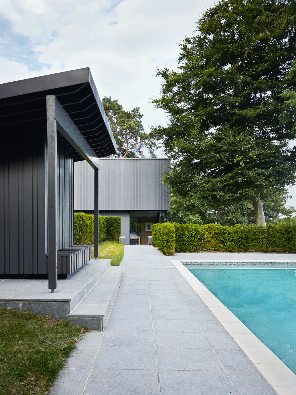 Image may contain Building Patio Water Pool and Housing