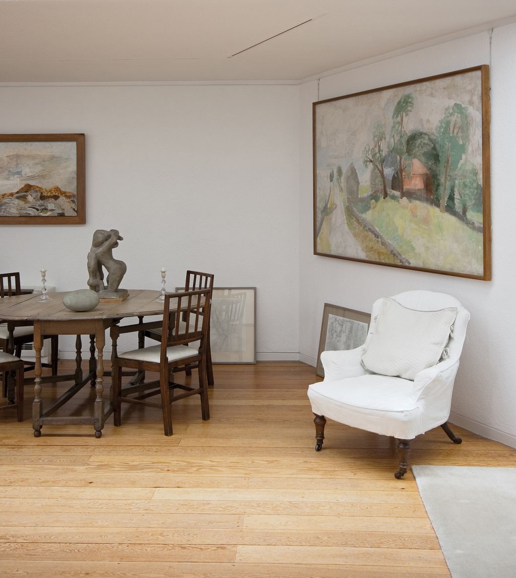 Image may contain Flooring Wood Hardwood Floor Furniture Chair Table Living Room Room Indoors and Plywood