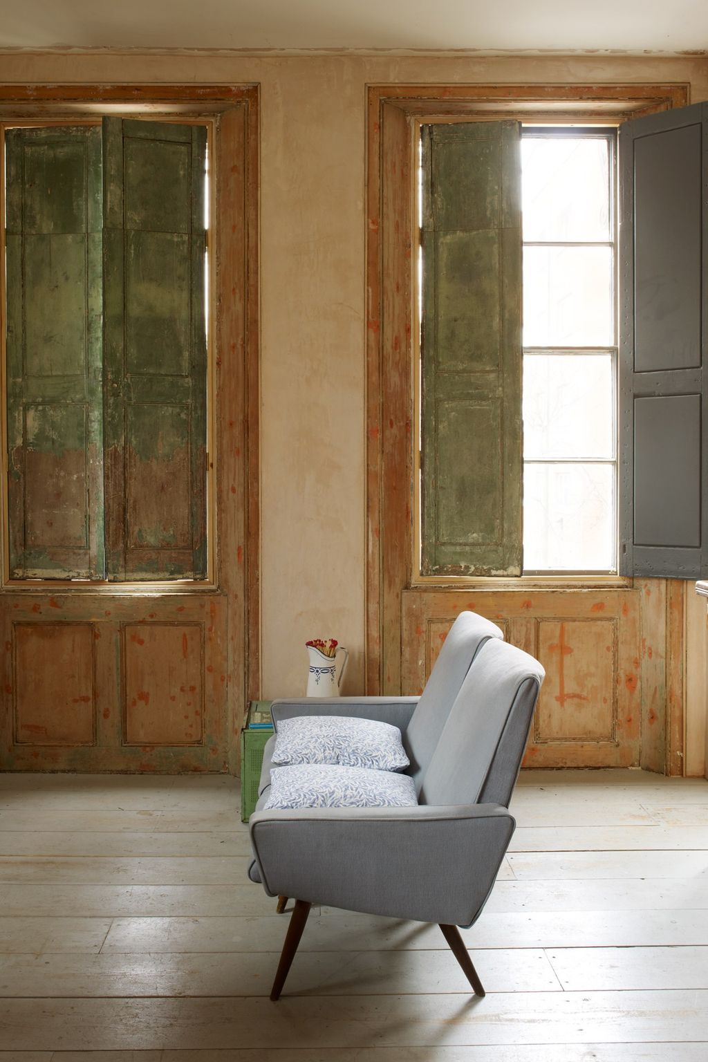 Image may contain Furniture Chair Wood Flooring Living Room Room Indoors Floor Hardwood Couch and Plywood