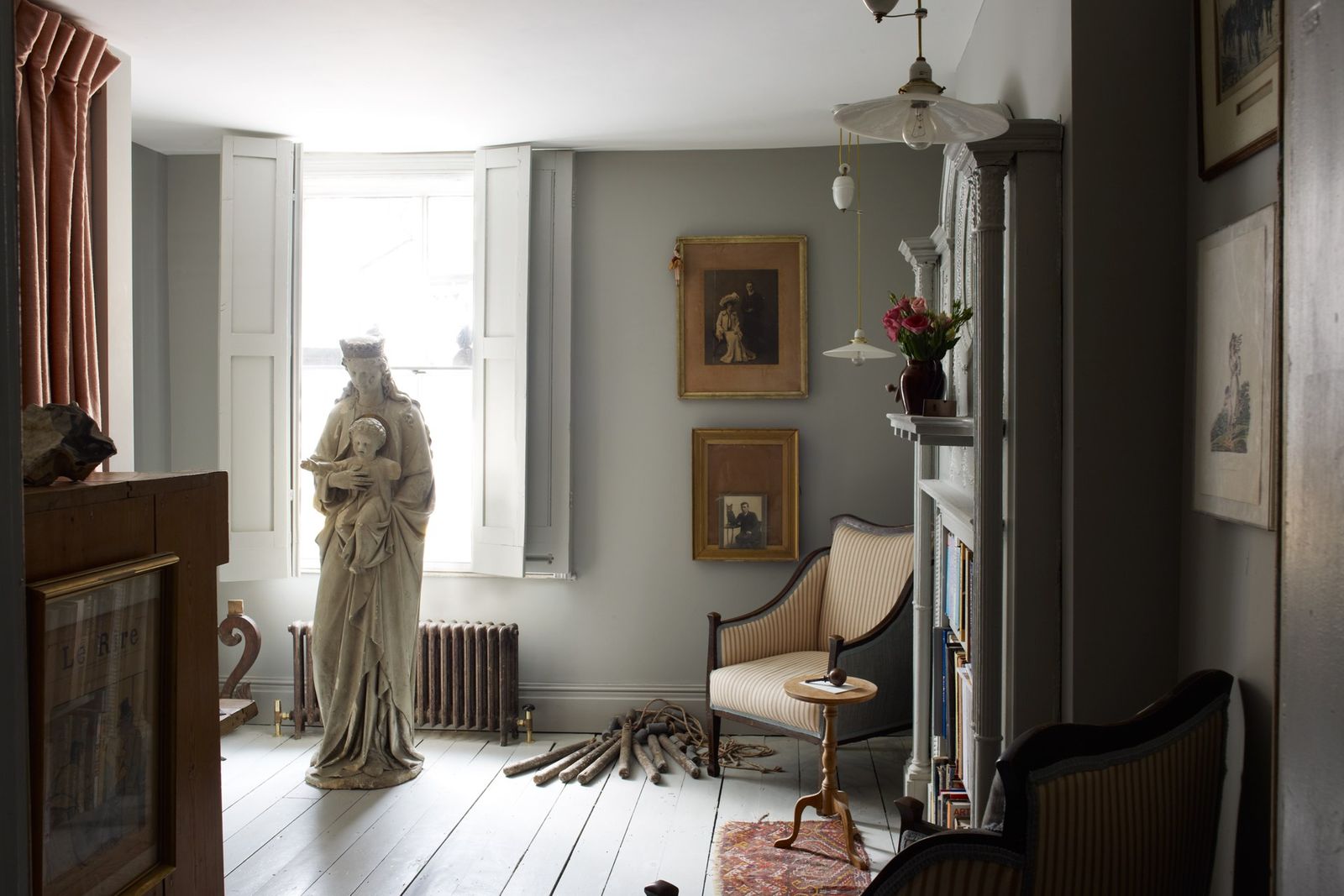 Image may contain Flooring Human Person Interior Design Indoors Wood Furniture Floor Living Room Room and Art