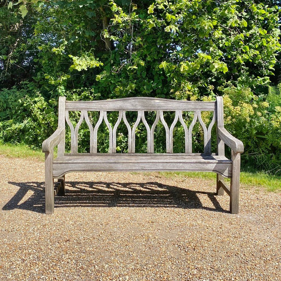 Image may contain Furniture Bench and Park Bench