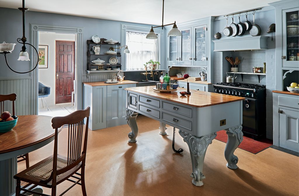 Image may contain Indoors Room Furniture Chair Kitchen Kitchen Island Wood and Hardwood