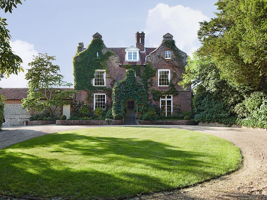 Image may contain Grass Plant Housing Building Lawn Cottage and House
