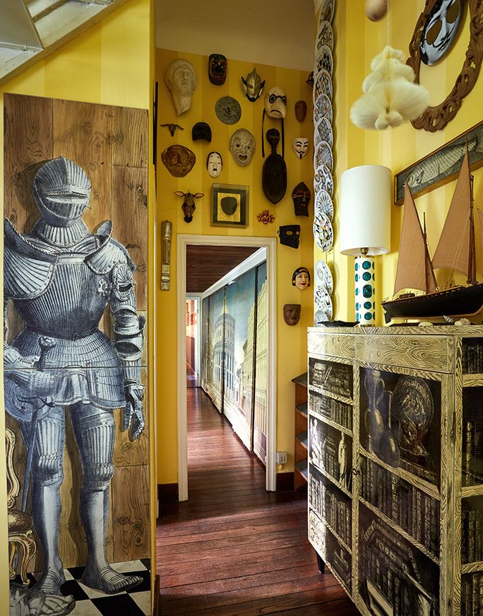 Image may contain Flooring Human Person Floor Wood Hardwood Interior Design Indoors Corridor Living Room and Room