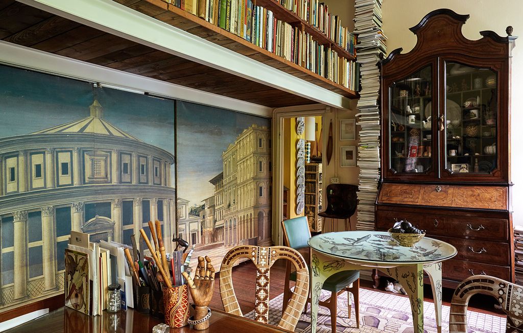 The mural in Barnaba's studio is a reproduction of a Città ideale by an anonymous pupil of Piero della Francesca....