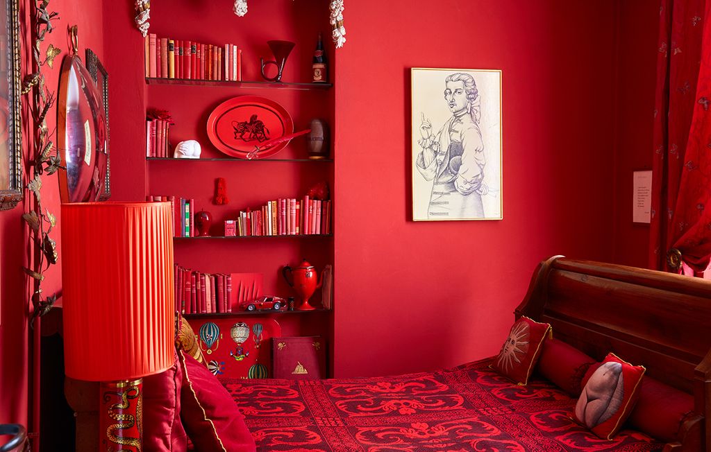 The red room based on a boudoir in the family's Como villa lives up to it's name. Barnaba designed the Polipo lamp in...