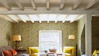 Image may contain Living Room Room Indoors Furniture Couch Flooring Table Interior Design Coffee Table and Floor