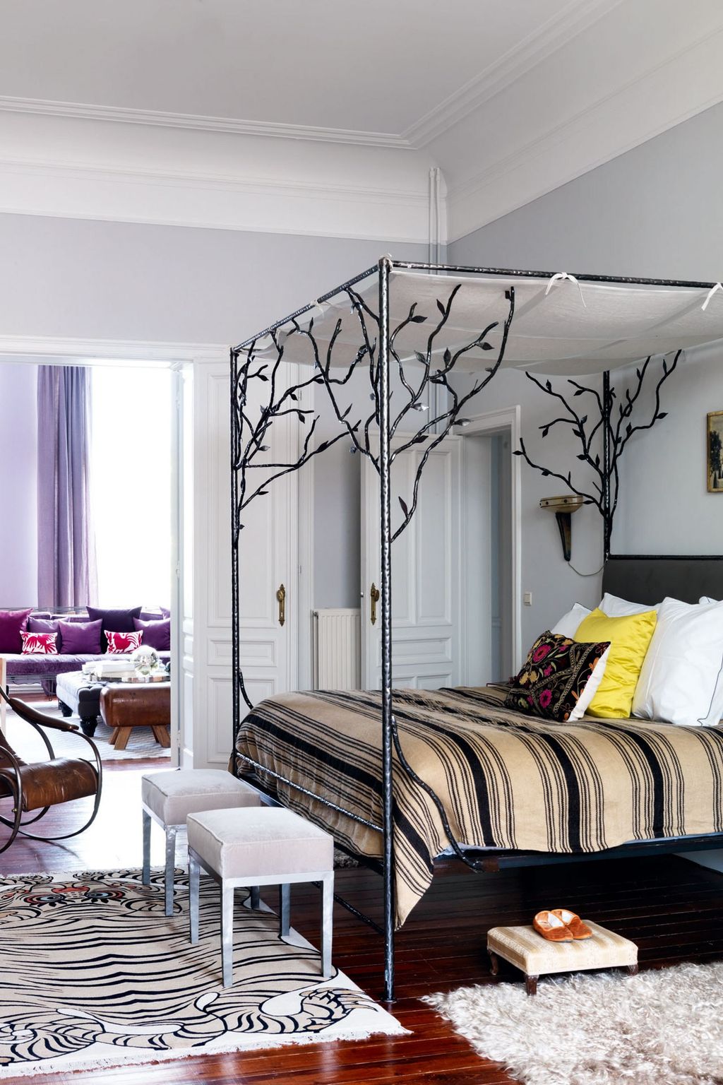 Image may contain Room Bedroom Indoors Furniture Living Room Dorm Room Bed Rug Cushion Pillow and Table