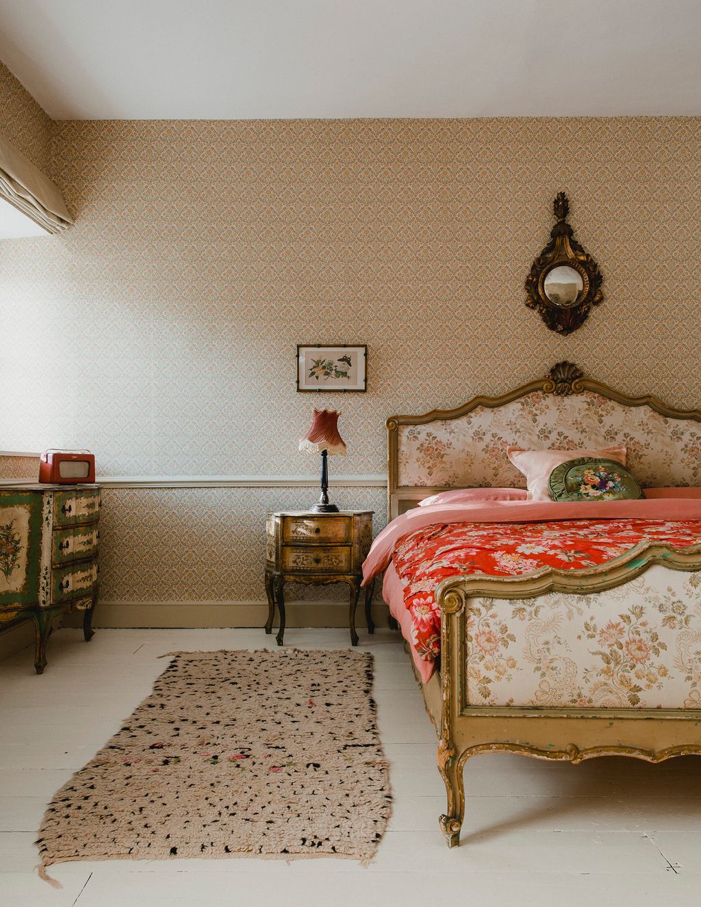 Image may contain Indoors Room Bedroom Furniture Rug Flooring Interior Design Bed Living Room and Floor