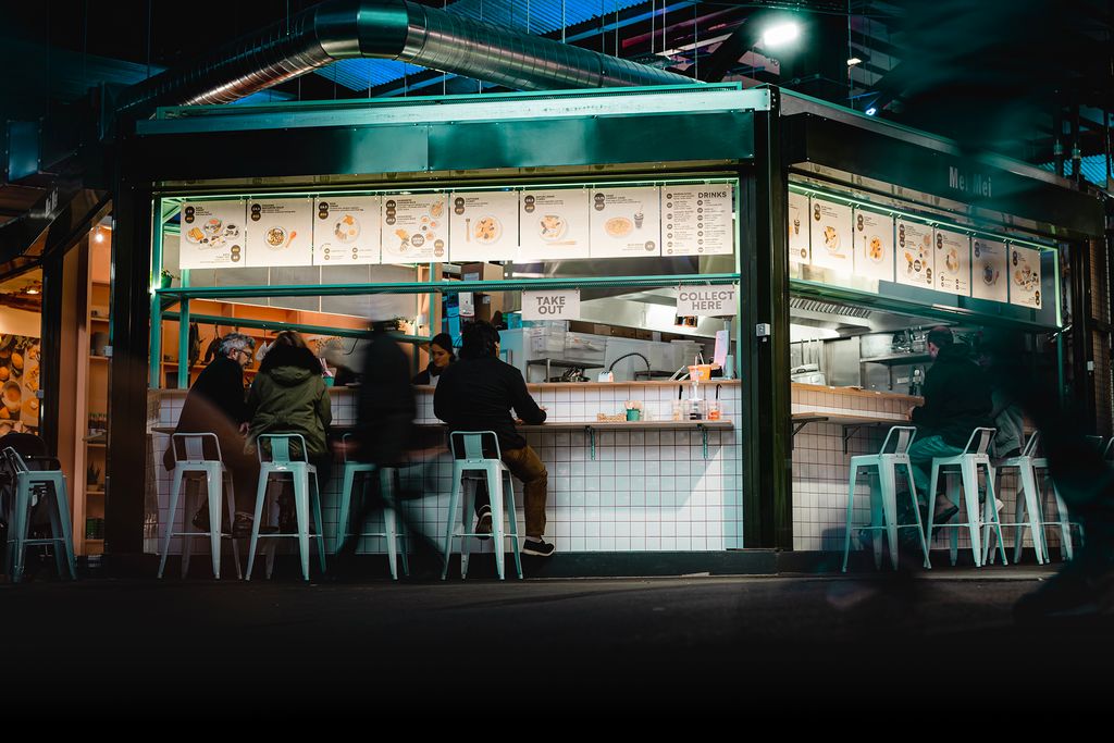 Image may contain Human Person Restaurant Kiosk Food Meal Cafeteria Footwear Clothing Shoe and Apparel