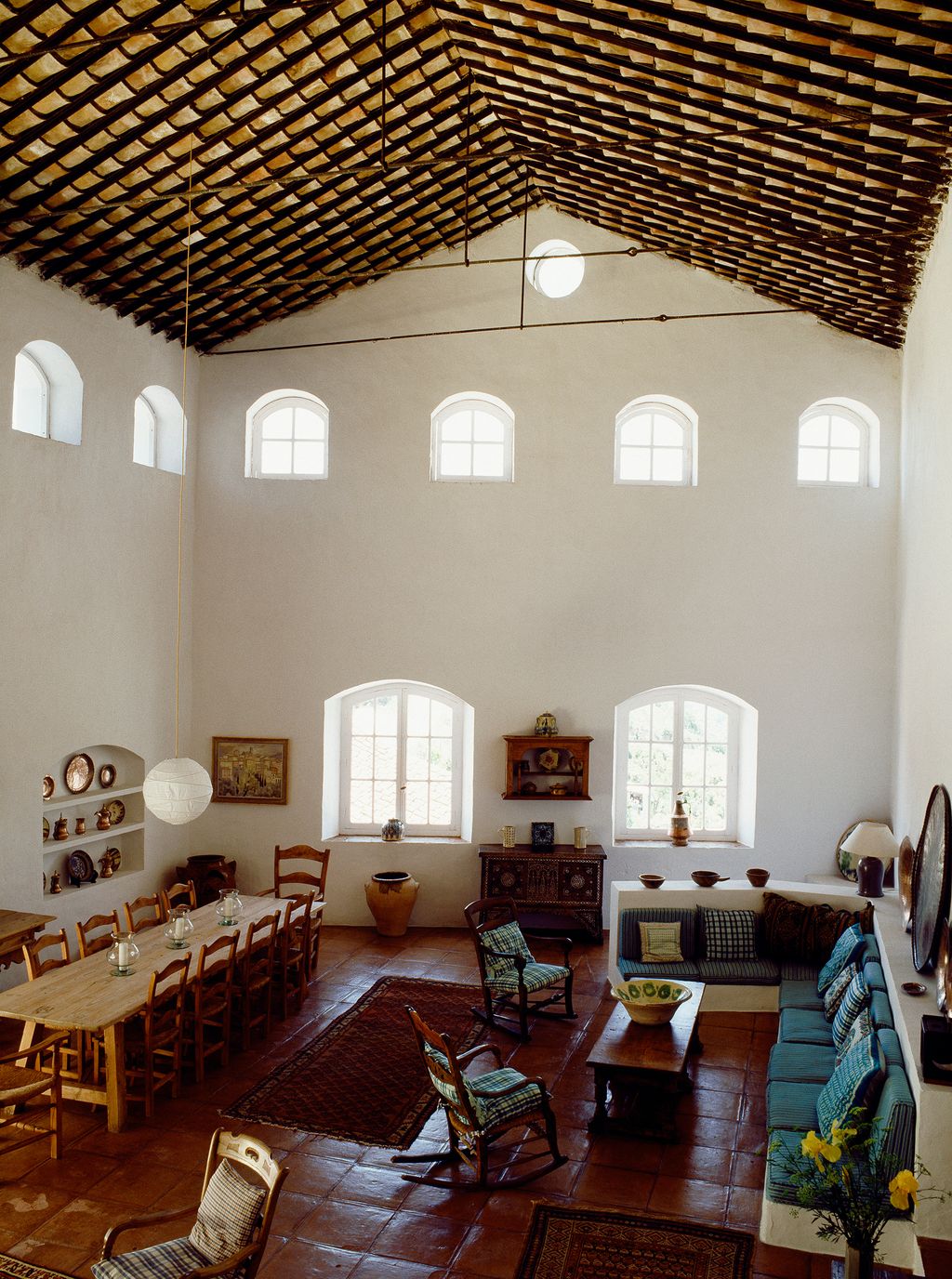 Image may contain Furniture Living Room Room Indoors Flooring Couch Wood Chair Interior Design Table and Rug