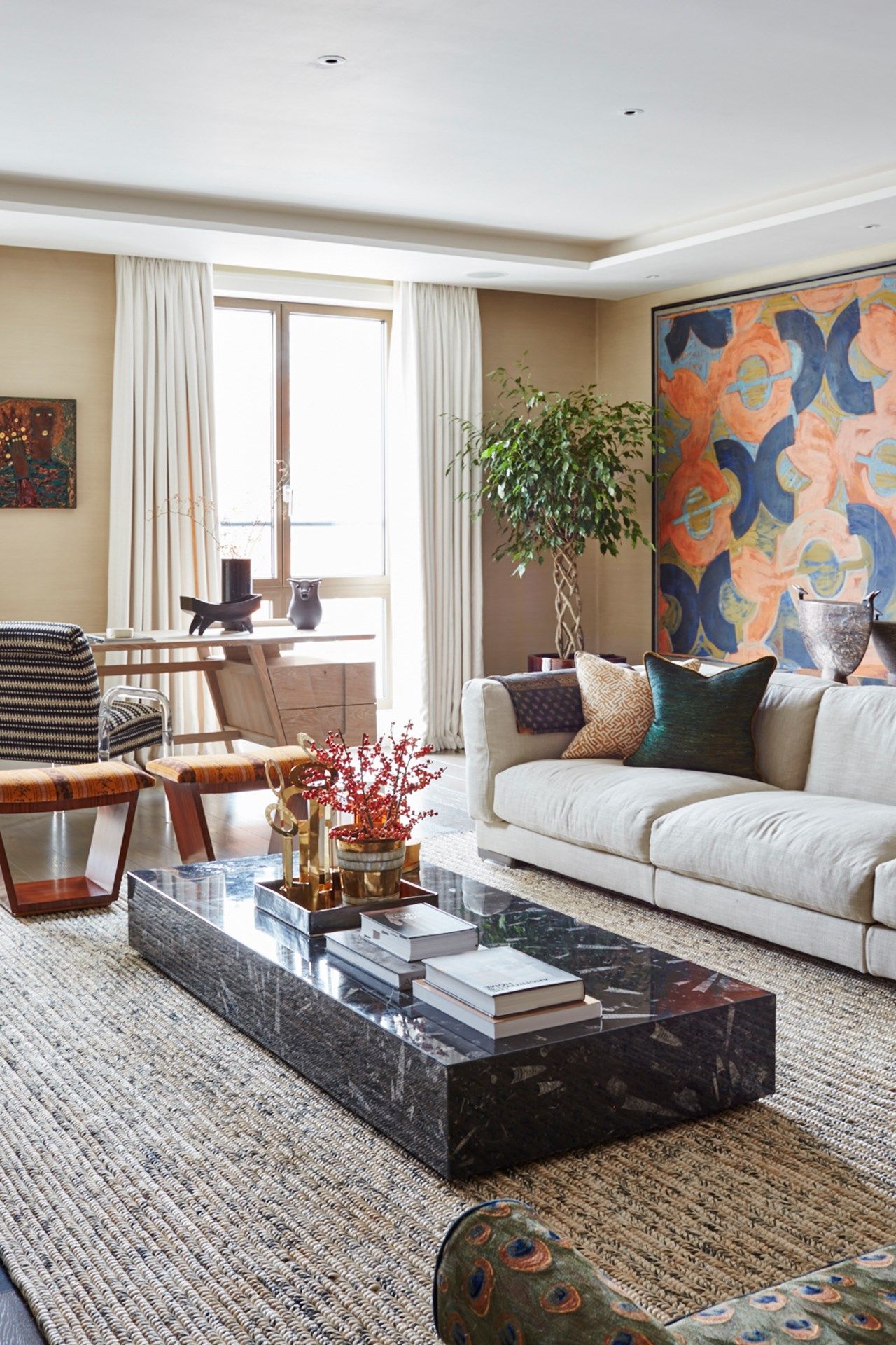 Image may contain Furniture Table Living Room Indoors Room Coffee Table Rug Interior Design and Couch