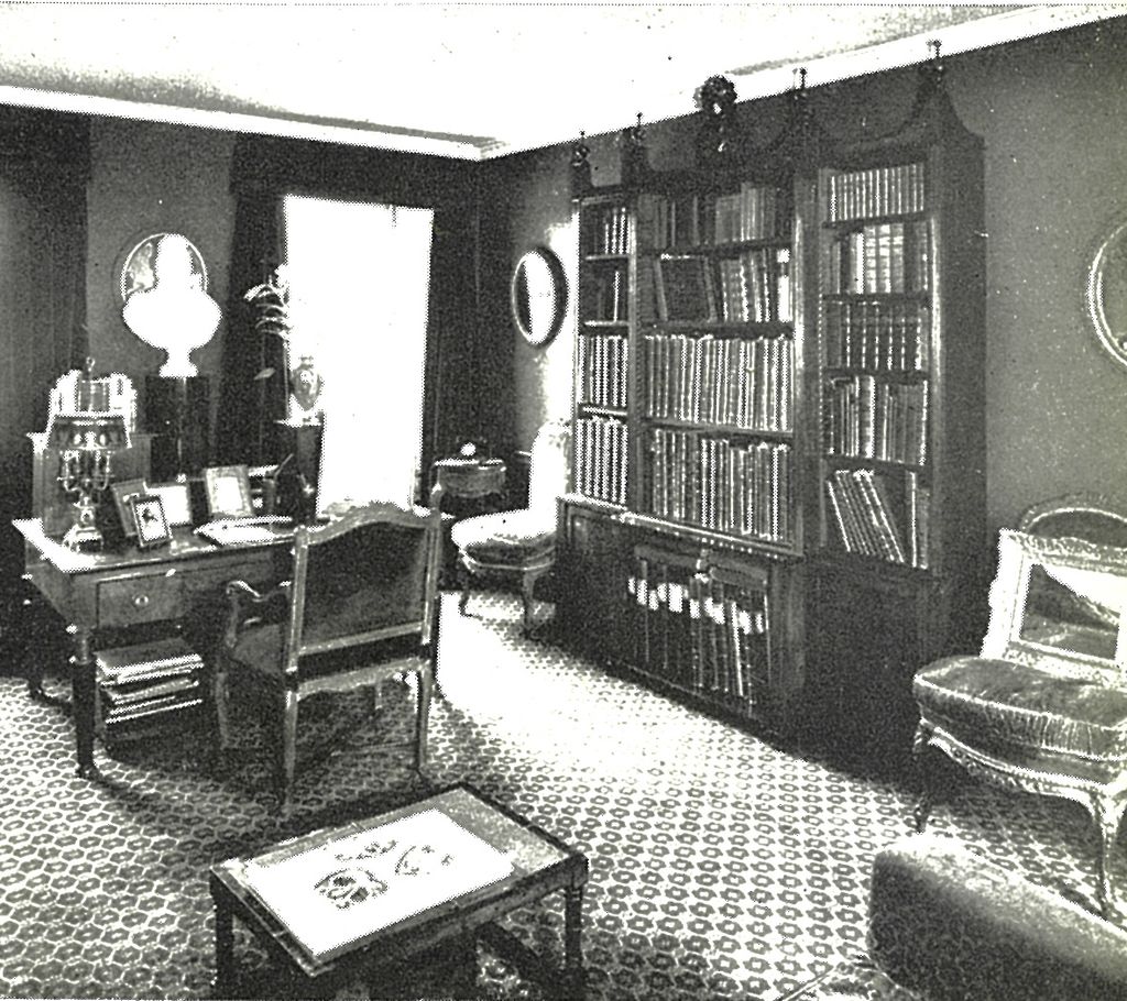 Image may contain Room Indoors Furniture Chair Interior Design Book Library Living Room Bookcase and Shelf