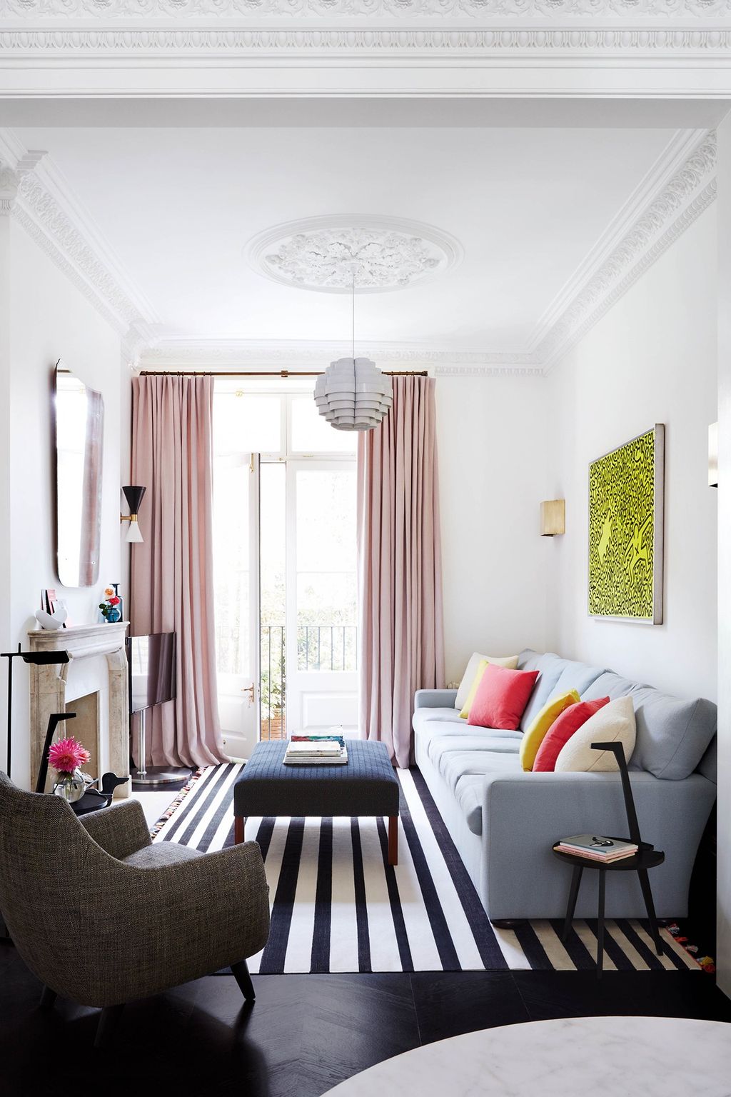 At the back of the sitting area a bespoke sofa by George Smith is accented with cushions covered in Prestwick wool satin...