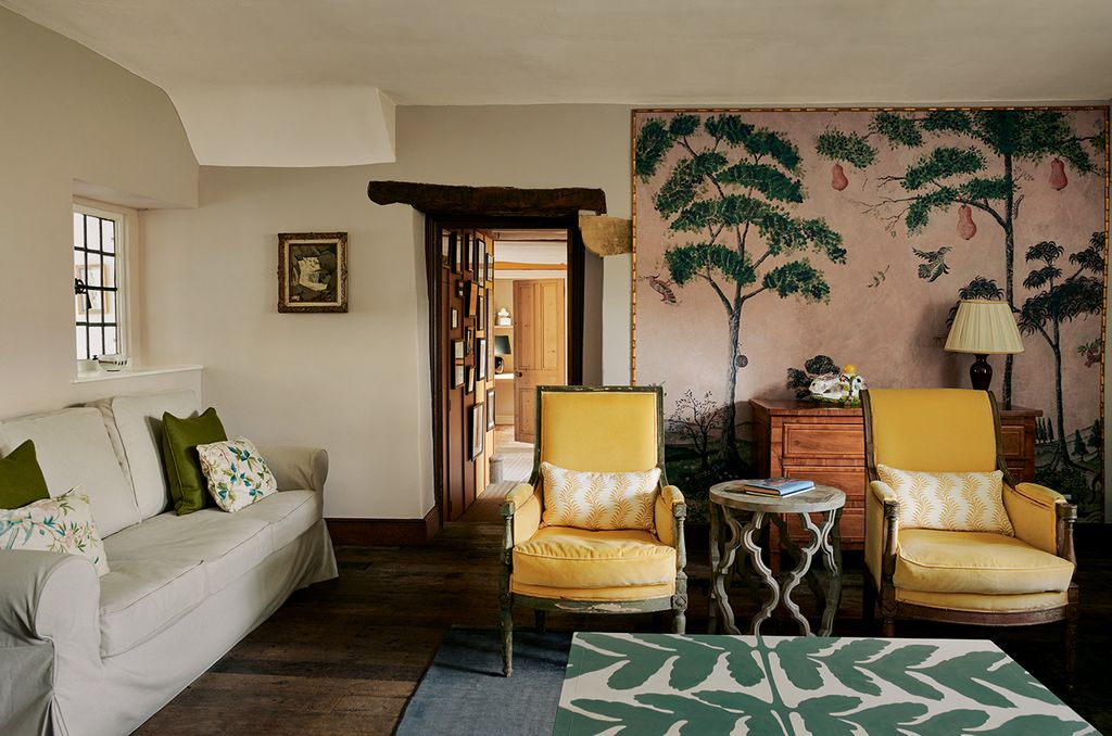 Image may contain Living Room Indoors Room Furniture Couch Home Decor Interior Design and Rug