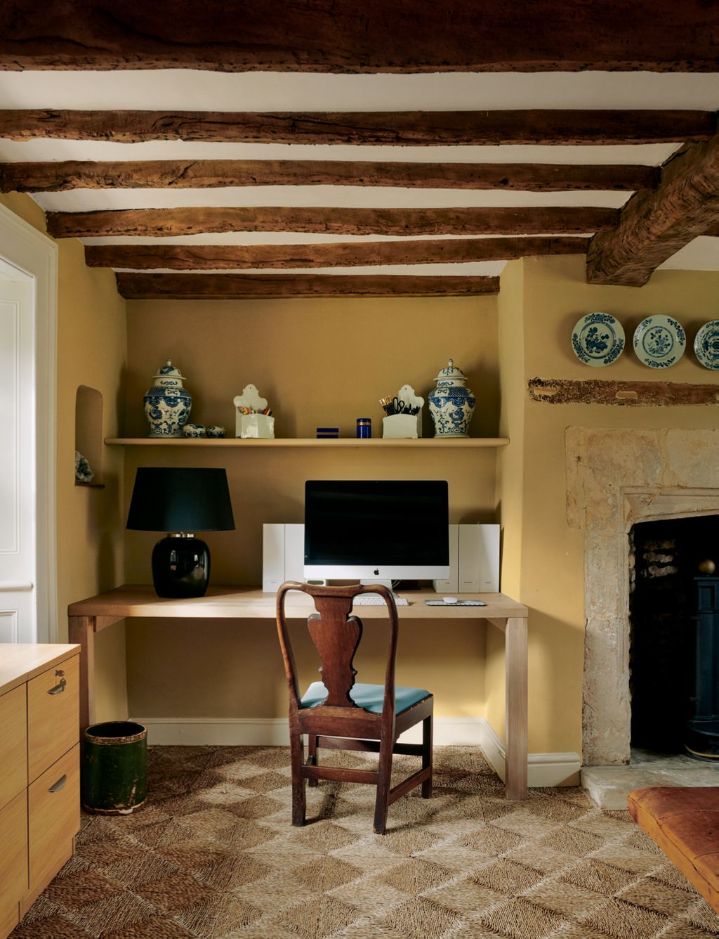 Image may contain Furniture Table Chair Desk Indoors Fireplace Electronics Monitor Display Screen and Lcd Screen