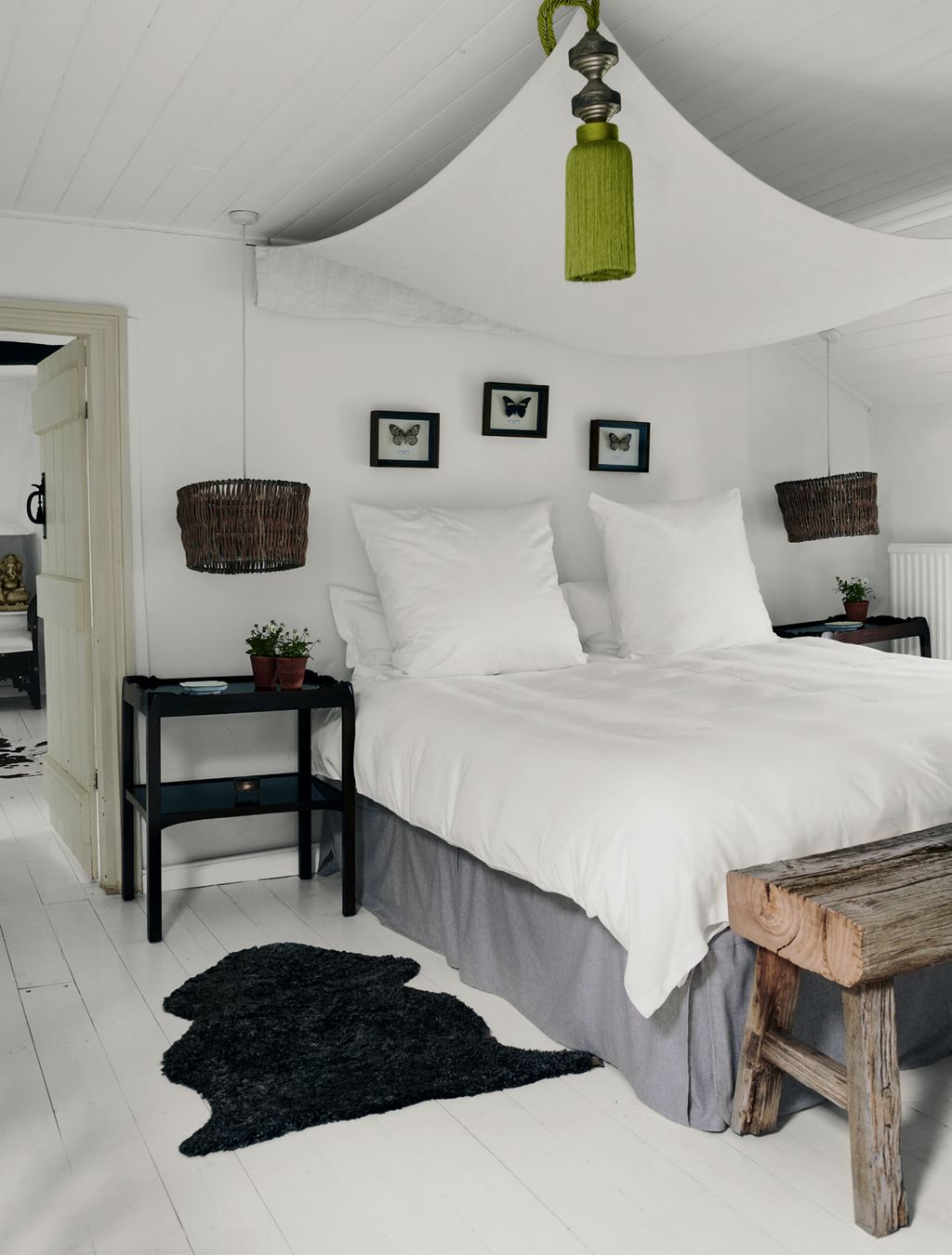 Image may contain Room Bedroom Indoors Furniture Bed Interior Design Housing Building Rug Cushion and Pillow