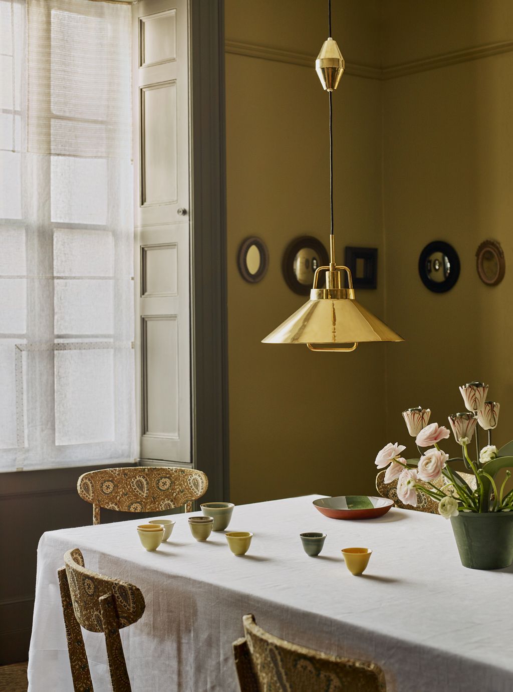 Image may contain Home Decor Furniture Chair Dining Table Table Plant Flower Blossom Room and Indoors