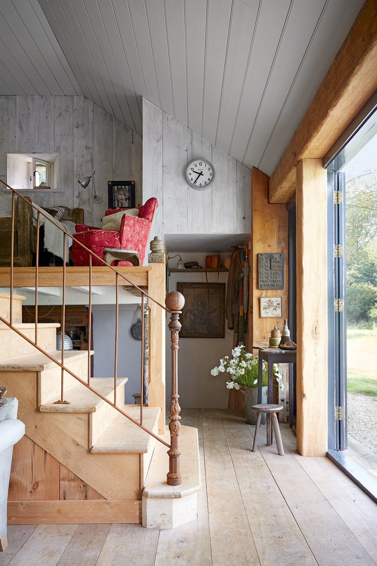 Image may contain Housing Building Interior Design Indoors Wood Flooring Loft Living Room Room and Hardwood