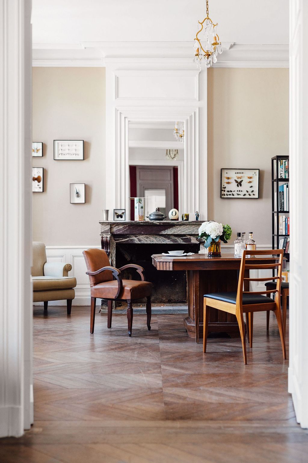 Image may contain Flooring Furniture Floor Wood Chair Table Living Room Room Indoors Hardwood and Interior Design