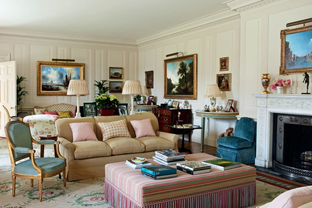 Image may contain Furniture Living Room Indoors Room Chair Rug and Ottoman