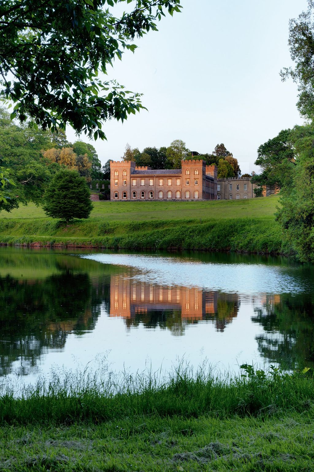 Image may contain Water Nature Outdoors Grass Plant Land Pond Architecture Building Castle and Fort