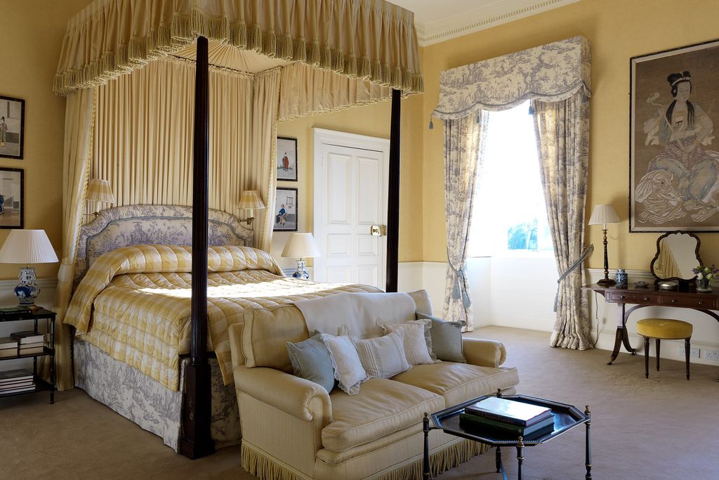 Image may contain Furniture Living Room Room Indoors Interior Design Flooring Wood Bedroom Couch Floor and Bed