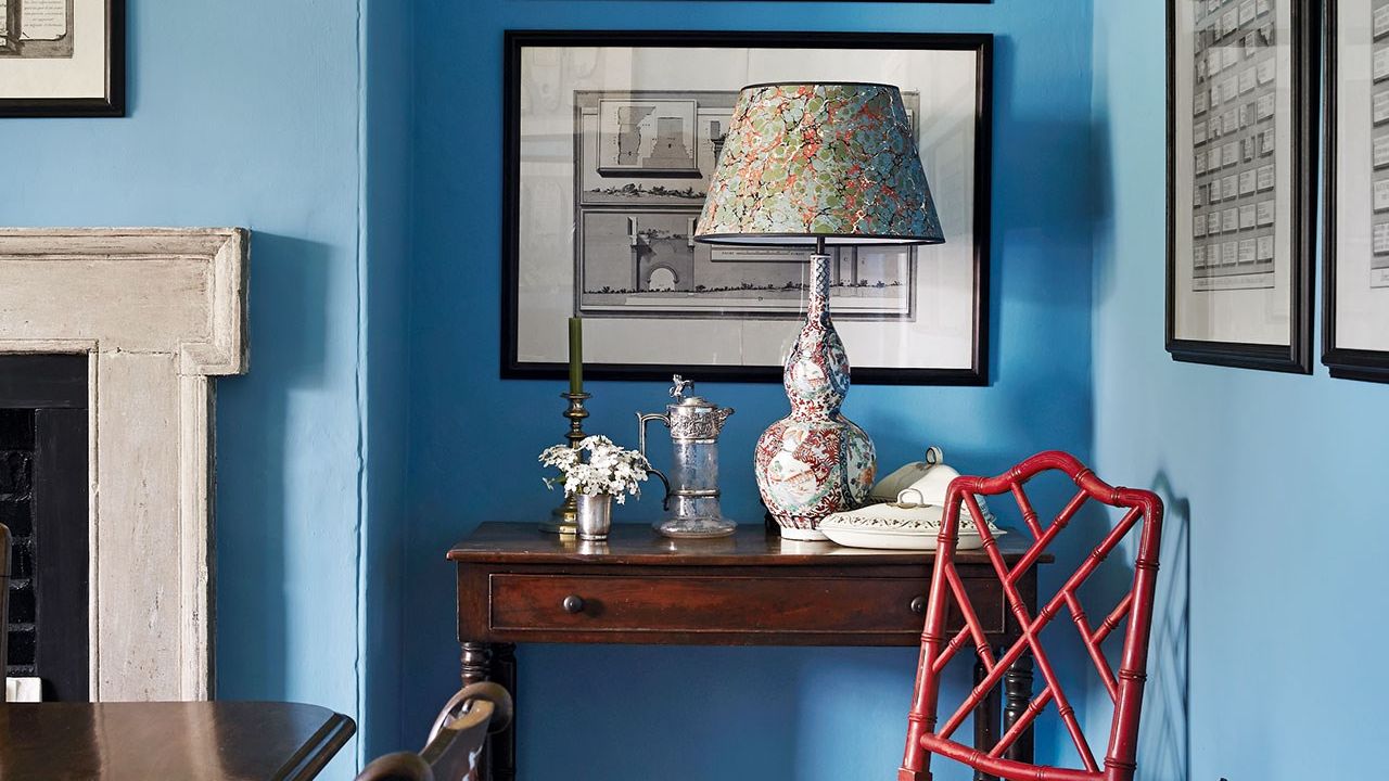 Image may contain: Furniture, Indoors, Chair, Interior Design, Living Room, Room, Table, Lamp, and Table Lamp