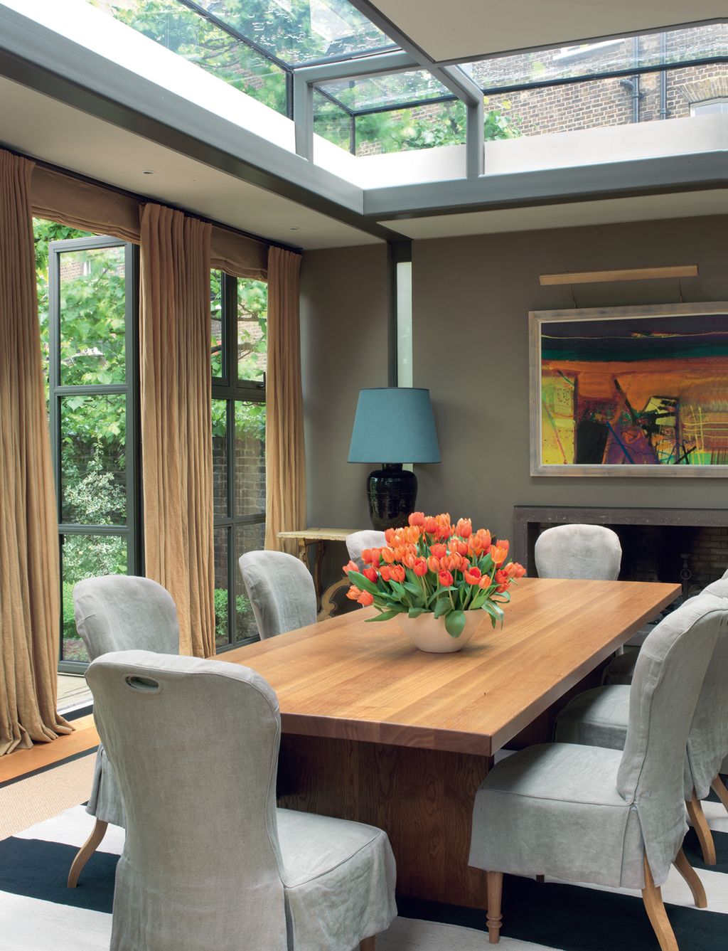 The dining chairs are from Christopher Howe Antiques the oak table is from Nico Villeneuve.