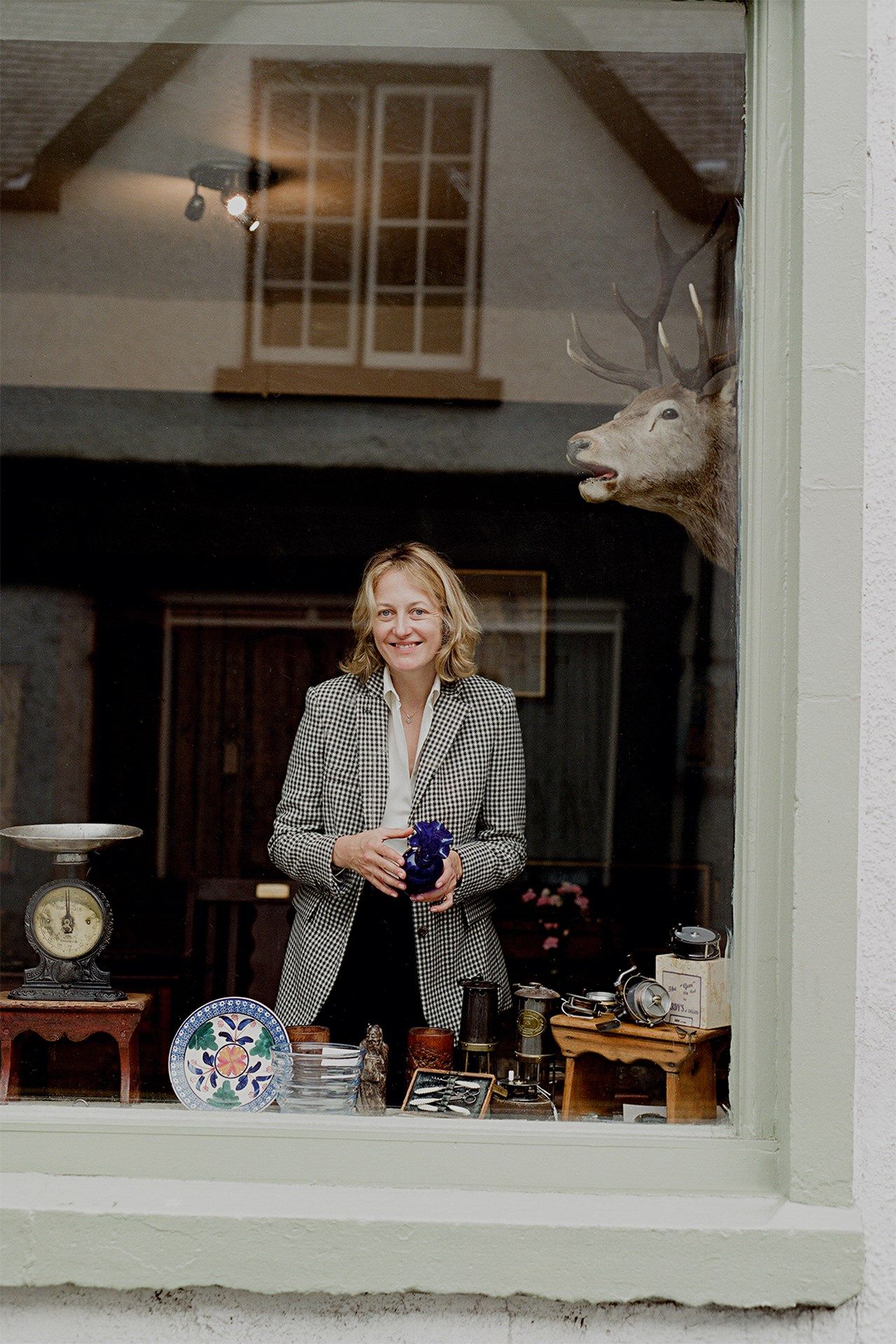 Image may contain Human Person Animal Wildlife Mammal Antelope Antler Home Decor Clock Tower and Architecture