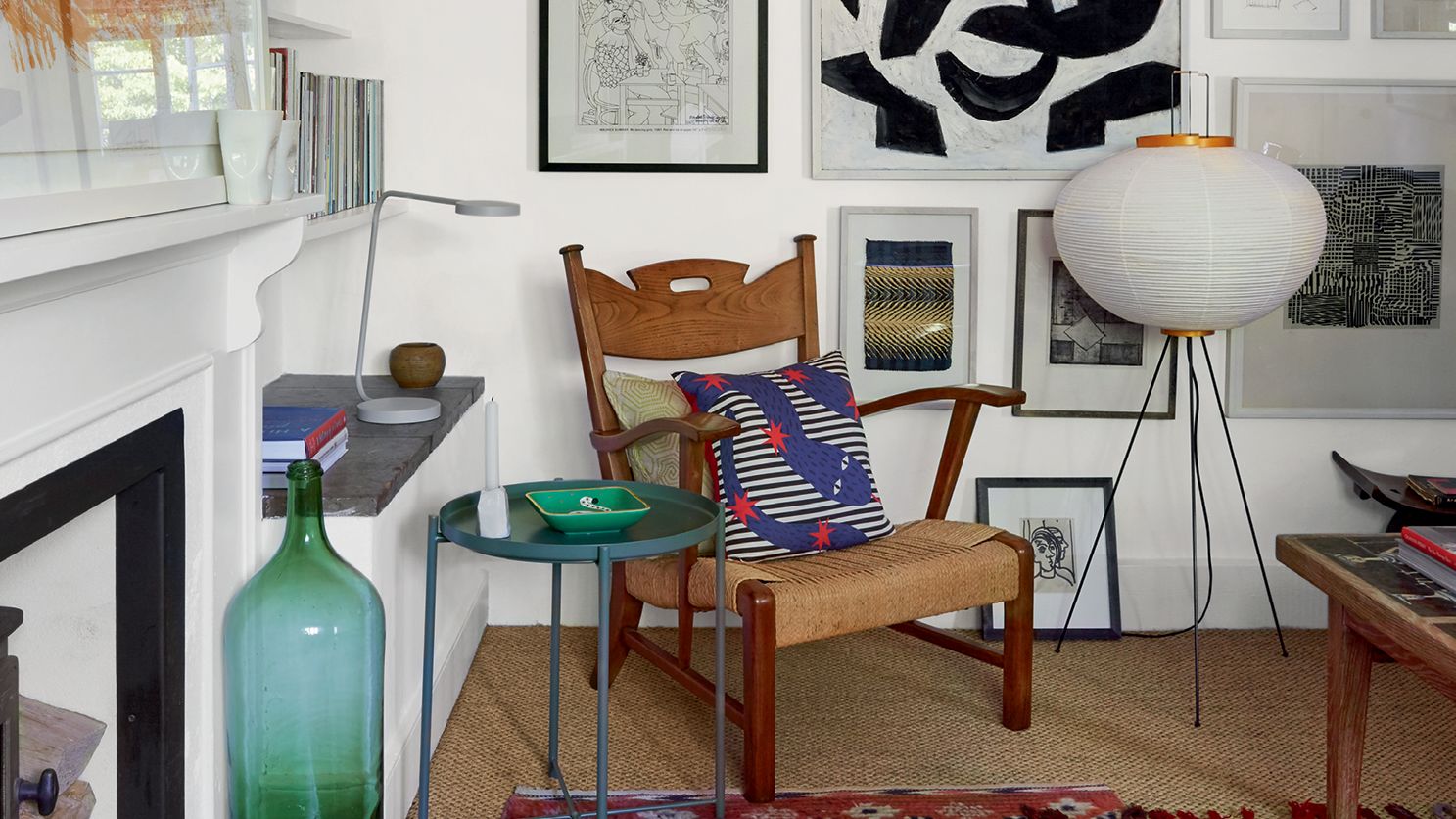 Image may contain: Living Room, Room, Indoors, Interior Design, Rug, Furniture, Shelf, and Flooring