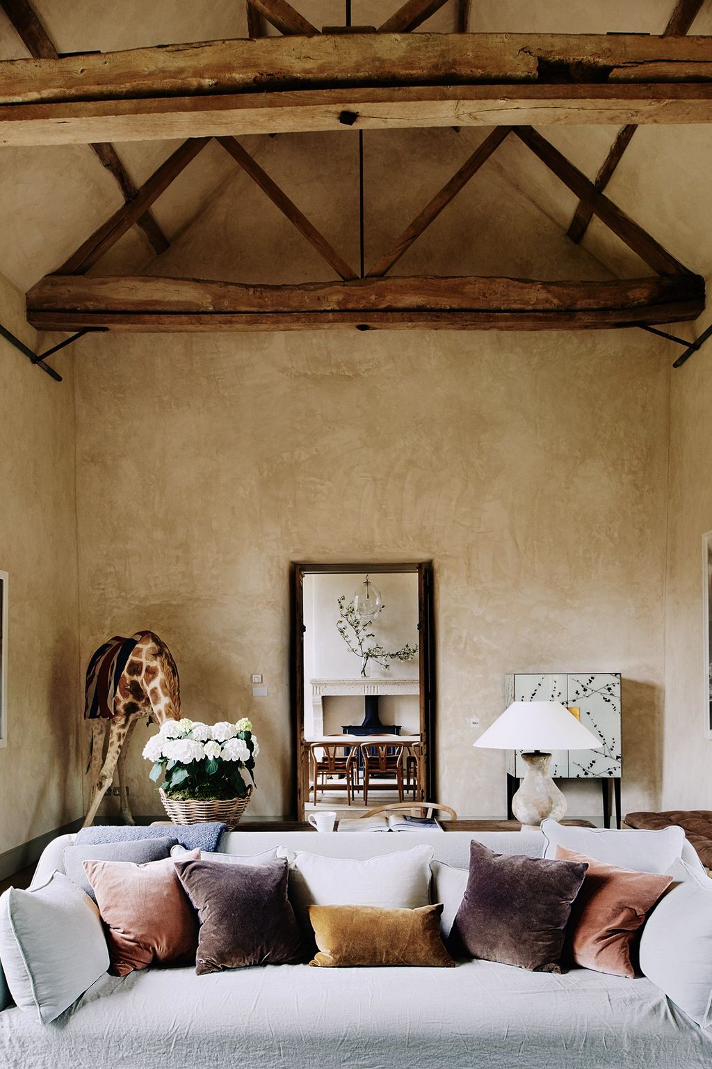 Image may contain Living Room Room Indoors Furniture Couch Table Interior Design and Cushion