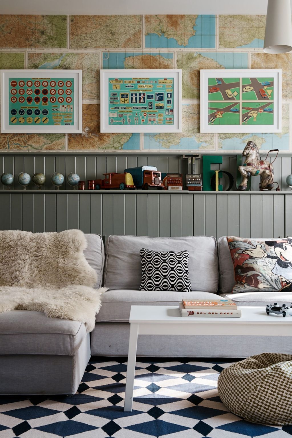 Image may contain Furniture Living Room Indoors Room Couch Table Cushion Rug Interior Design and Coffee Table