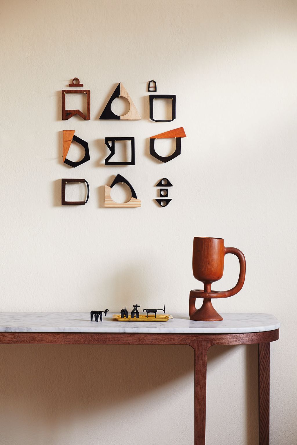 WALLS    •	‘Matchstick paint 45 for 2.5 litres matt emulsion from Farrow  Ball.   •	Tanzanian rings made from mixed...