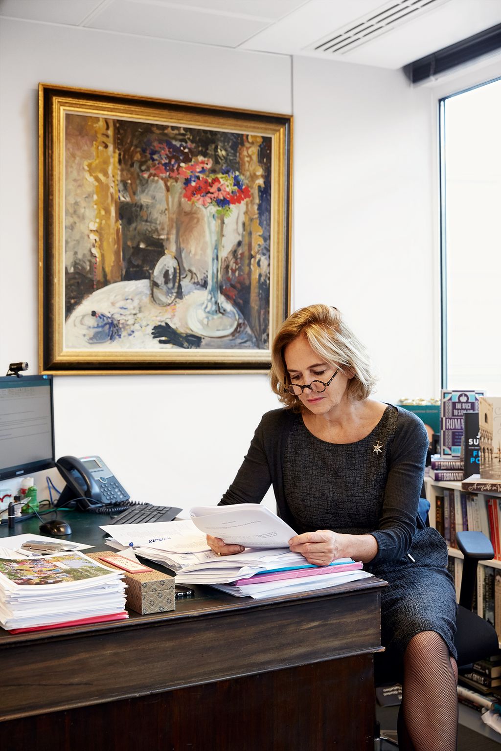 Image may contain Human Person Furniture Desk Table Sitting Electronics Computer Laptop Pc Monitor and Display